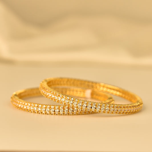 AD Bangle with Gold Polish looks like real Diamond bangle with white stone arranged in beautiful line pattern