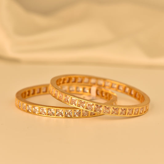 AD Bangle with Gold Polish looks like real Diamond bangle with square cut white stone arranged in beautiful  box design