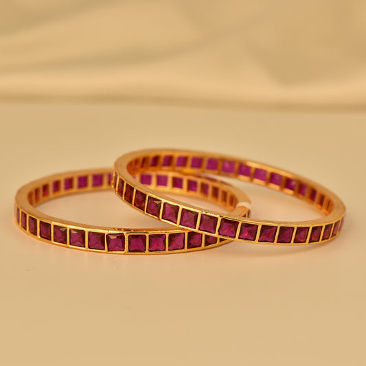 AD Bangle with Gold Polish looks like real Diamond bangle with square cut ruby color stone arranged in beautiful box design