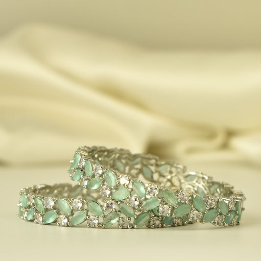 AD Bangle with silver Polish looks like real Diamond stone beautiful arranged in leaf pattern highlighted with pastel green stone