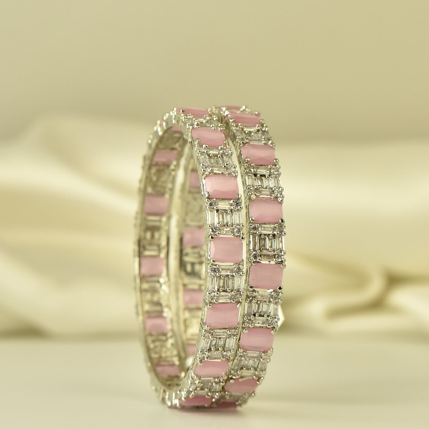 AD Bangle with silver Polish looks like real Diamond stone beautiful arranged in box pattern highlighted with square cut pastel pink stone